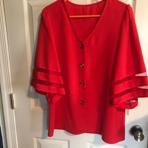 Brilliant color ladies blouse, sheer material on sleeves.